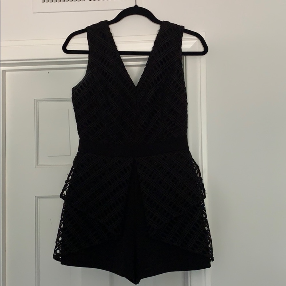 black mini jumpsuit with lace detailing